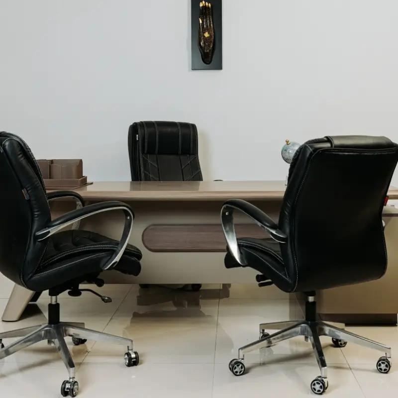 Executive office desk with file cabinet and chair